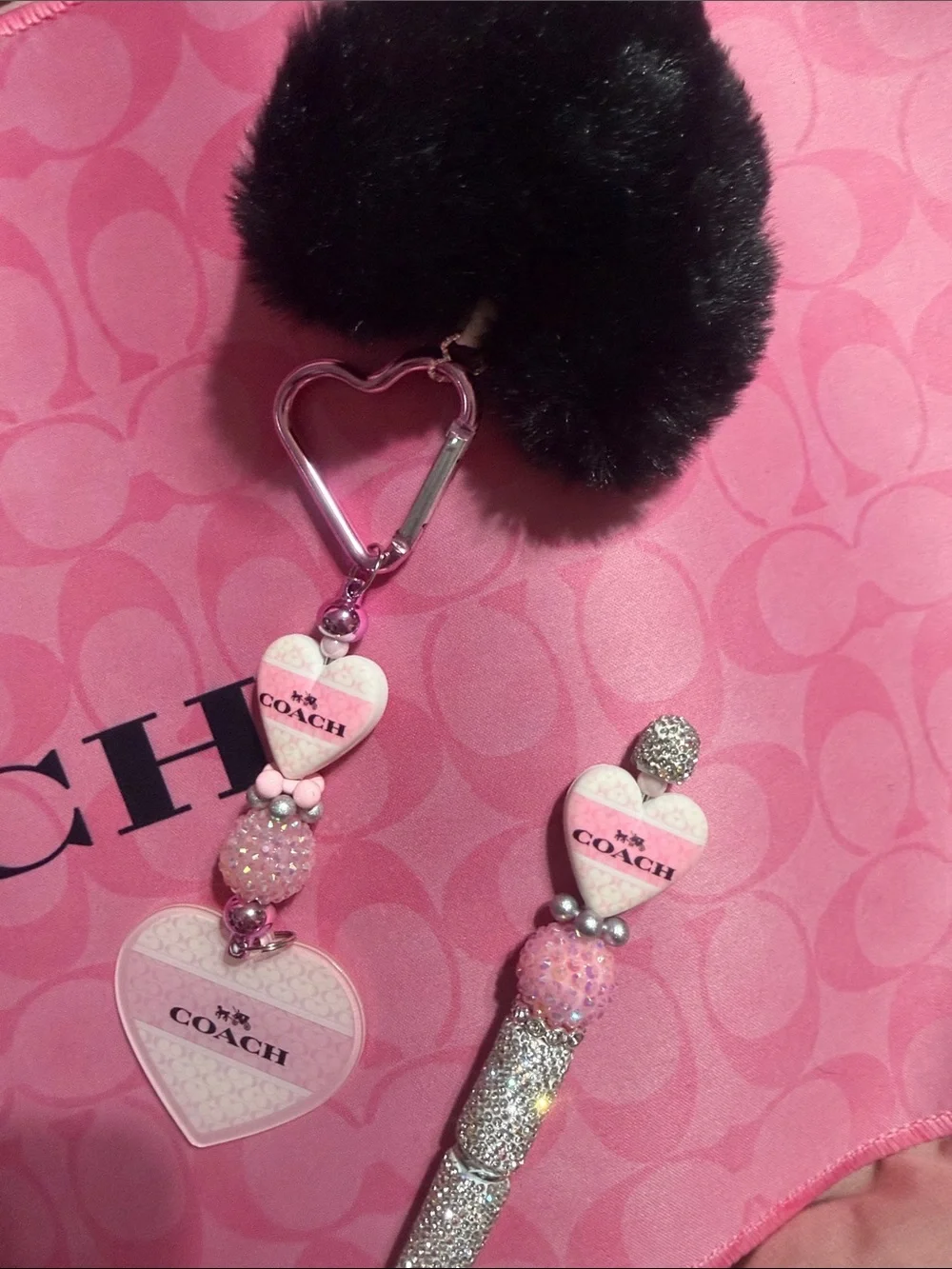 Pink & black journal w/ matching pen, keychain, desk mat and fan.
